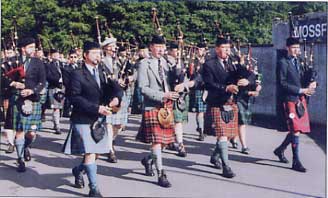 Bruce leading the Pipers to the field, the day after winning the Oban Medal - 2003