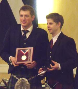 Andrew Lee receiving the Gold Medal from R.G.Hardie's Alastair Dunn