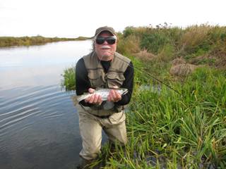 Captain with one of several rainbow trout